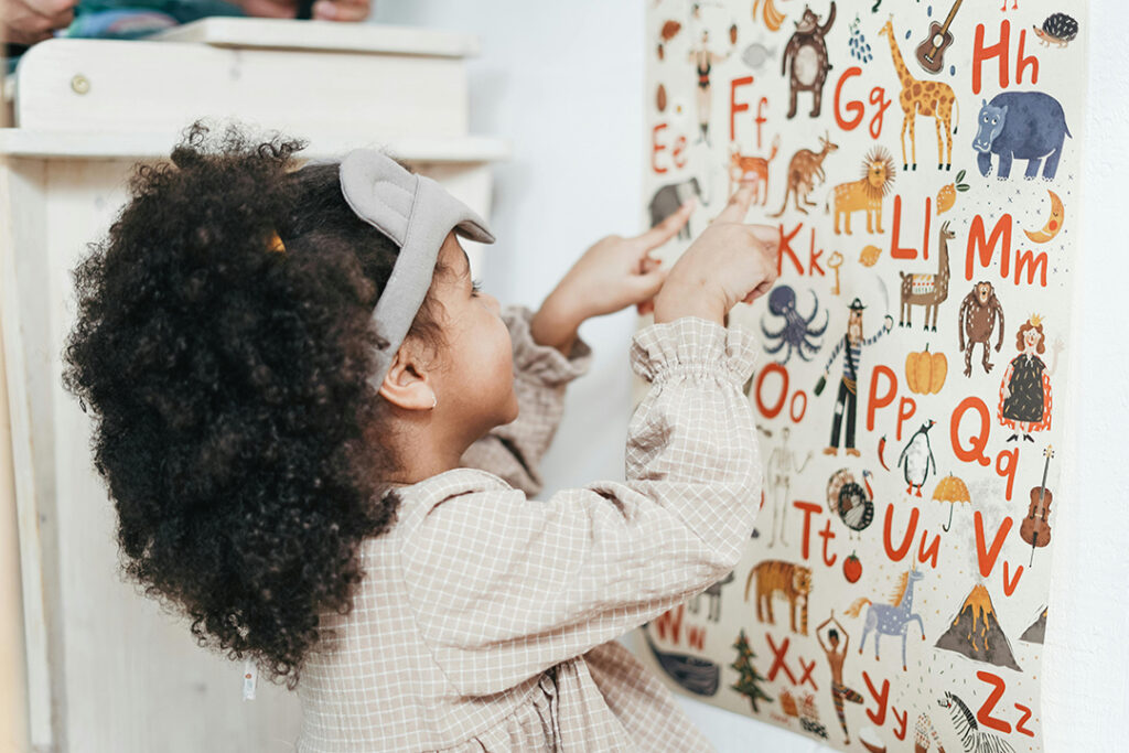 Young girl learning alphabet